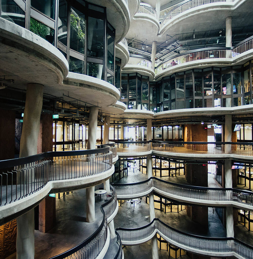 A large building with many floors and balconies.